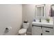 Stylish powder room features shiplap detail, a modern vanity, and attractive fixtures at 450 E Alamosa Dr, Chandler, AZ 85249