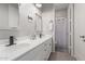 Bright bathroom featuring double sinks, modern faucets, and white cabinetry at 450 E Alamosa Dr, Chandler, AZ 85249