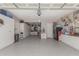 Spacious garage with epoxy floors, storage cabinets, and ample parking at 450 E Alamosa Dr, Chandler, AZ 85249