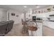 Kitchen island with barstool seating, white cabinets, and decor at 450 E Alamosa Dr, Chandler, AZ 85249