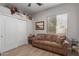 Cozy living room features a sofa, window, and unique decorative elements at 450 E Alamosa Dr, Chandler, AZ 85249