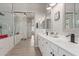 Elegant main bathroom features double sinks, quartz counters, and a walk-in shower at 450 E Alamosa Dr, Chandler, AZ 85249