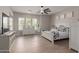 Spacious main bedroom with abundant natural light and luxury vinyl plank flooring at 450 E Alamosa Dr, Chandler, AZ 85249