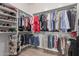 Well-organized walk-in closet providing ample storage with shelves and hanging rods at 450 E Alamosa Dr, Chandler, AZ 85249