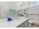 Bathroom with tiled floors and neutral cabinets under a white quartz countertop at 5009 E Baker Dr, Cave Creek, AZ 85331