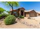 Charming home featuring desert landscaping, a tiled roof, and an arched entryway at 5009 E Baker Dr, Cave Creek, AZ 85331