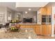 Open-concept kitchen featuring granite countertops and stainless steel appliances with adjoing Gathering room at 5009 E Baker Dr, Cave Creek, AZ 85331