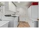 Well-lit laundry room featuring modern appliances, ample cabinet space, and convenient storage at 5009 E Baker Dr, Cave Creek, AZ 85331