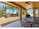 Covered patio with outdoor seating overlooking a landscaped backyard at 5009 E Baker Dr, Cave Creek, AZ 85331