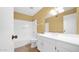 Bright bathroom with white vanity, neutral walls, and a combined shower and bathtub at 5216 W Beryl Ave, Glendale, AZ 85302