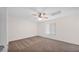 Bedroom featuring neutral carpeting, a ceiling fan, and a large window for plenty of natural light at 5216 W Beryl Ave, Glendale, AZ 85302