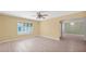 Spacious living room featuring new floors, a ceiling fan, neutral paint, and great natural light at 5216 W Beryl Ave, Glendale, AZ 85302