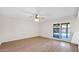 Spacious living room with new wood-look floors and sliding glass doors to the backyard patio at 5216 W Beryl Ave, Glendale, AZ 85302