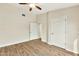 Bright bedroom with light-colored walls, two closets and plank flooring at 5249 E Shea Blvd # 214, Scottsdale, AZ 85254