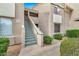 Charming building exterior with landscaped grounds and convenient stair access to upper-level units at 5249 E Shea Blvd # 214, Scottsdale, AZ 85254