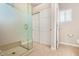 Bathroom featuring a glass shower, carpeted floor, and dual pane window at 5400 S Hardy Dr # 110, Tempe, AZ 85283