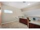 Carpeted loft space featuring built-in cabinets, a countertop and a chair at 5400 S Hardy Dr # 110, Tempe, AZ 85283