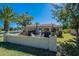 Expansive backyard with a covered patio, outdoor seating, and a lush lawn, perfect for entertaining and relaxation at 555 Leisure World --, Mesa, AZ 85206