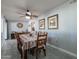 Comfortable dining room with a decorative ceiling fan and open access to the kitchen at 555 Leisure World --, Mesa, AZ 85206