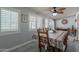 Dining room with windows with shutters and view of the backyard patio at 555 Leisure World --, Mesa, AZ 85206