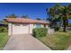 Single-story home featuring a well-kept front yard and an attached two-car garage at 555 Leisure World --, Mesa, AZ 85206