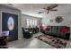 Comfortable living room featuring tile floors, a ceiling fan, and large windows at 555 Leisure World --, Mesa, AZ 85206