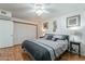 Fourth view of the cozy main bedroom features wood floors, and decor at 555 Leisure World --, Mesa, AZ 85206