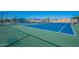 Well-maintained blue and green tennis court with net and fencing at 555 Leisure World --, Mesa, AZ 85206