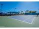 Well-maintained tennis court with blue canopy and landscaping at 555 Leisure World --, Mesa, AZ 85206