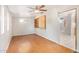 Dining Room with light brick wall, laminate flooring, windows, and ceiling fan at 5618 E Des Moines St, Mesa, AZ 85205