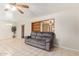 Open-concept living area with tile floors, a ceiling fan, neutral colors, and lots of natural light at 5618 E Des Moines St, Mesa, AZ 85205