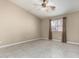 Neutral bedroom with tile floors, a ceiling fan, and a window providing natural light at 562 W Enchanted Desert Dr, Casa Grande, AZ 85122