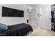 Bedroom with black sound-dampening panels on the wall and a view into the hallway at 562 W Enchanted Desert Dr, Casa Grande, AZ 85122