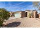 View of a single story house featuring xeriscaping and solar panels on the roof at 562 W Enchanted Desert Dr, Casa Grande, AZ 85122