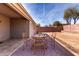 Covered patio with stylish tile flooring, perfect for outdoor seating and entertainment at 562 W Enchanted Desert Dr, Casa Grande, AZ 85122