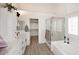 Bright and spacious bathroom featuring a soaking tub and modern fixtures at 5624 E Garnet Ave, Mesa, AZ 85206