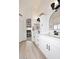 Bright bathroom features dual vanities, modern fixtures, and arched mirrors in a spacious design at 5624 E Garnet Ave, Mesa, AZ 85206