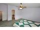 Relaxing bedroom with a ceiling fan and an en-suite bathroom at 5624 E Garnet Ave, Mesa, AZ 85206