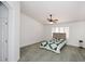 Bedroom featuring ceiling fan and shutters on the windows at 5624 E Garnet Ave, Mesa, AZ 85206