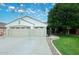 Charming home featuring a convenient three-car garage and beautiful landscaping at 5624 E Garnet Ave, Mesa, AZ 85206