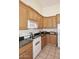 A kitchen featuring matching wood cabinets, granite countertops, and stainless appliances at 5624 E Garnet Ave, Mesa, AZ 85206