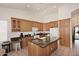A kitchen with lots of matching wood cabinets and a center island with granite countertops at 5624 E Garnet Ave, Mesa, AZ 85206