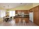 Bright kitchen featuring a central island, tiled floors, and ample cabinet space at 5624 E Garnet Ave, Mesa, AZ 85206