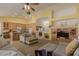 Spacious living room features a built-in entertainment center and smooth transition to kitchen at 5624 E Garnet Ave, Mesa, AZ 85206