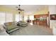 Well-lit living room flows into kitchen, offering views of the breakfast nook and backyard at 5624 E Garnet Ave, Mesa, AZ 85206