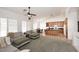 Spacious living room with vaulted ceilings, a ceiling fan, and a view of the kitchen at 5624 E Garnet Ave, Mesa, AZ 85206