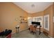 Home office offers two monitors, built-in shelves, neutral paint, and plenty of natural light at 5624 E Garnet Ave, Mesa, AZ 85206