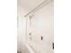Bright shower space with white tiling, curtain rod, and shower head offering a spa-like experience at 5624 E Garnet Ave, Mesa, AZ 85206