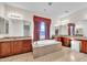 Elegant bathroom featuring a soaking tub, dual sinks, and ample counter space at 5634 N 82 Ave, Glendale, AZ 85303