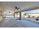 Expansive covered patio perfect for outdoor entertaining and relaxation with ceiling fans and views of the spacious backyard at 5634 N 82 Ave, Glendale, AZ 85303